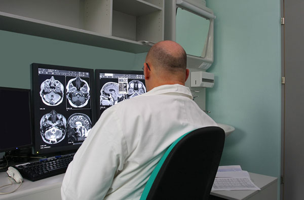 Person Reviewing CT scans